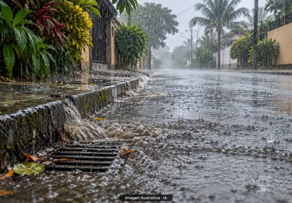 Ilustración con IA de lluvia intensa, charcos y una alcantarilla en una calle tropical